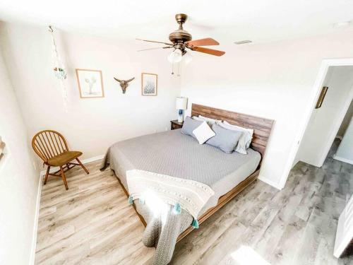 a bedroom with a bed and a ceiling fan at PRIVATE VIEW ON THE LAKE SIDE OF 95! Sleeps 16 in Lake Havasu City