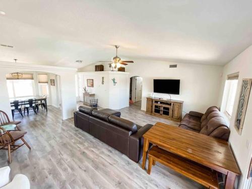 a living room with a couch and a table at PRIVATE VIEW ON THE LAKE SIDE OF 95! Sleeps 16 in Lake Havasu City
