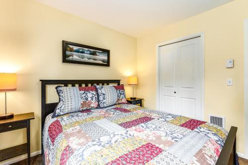 a bedroom with a bed and two lamps at Port Townsend Kala Point in Port Townsend