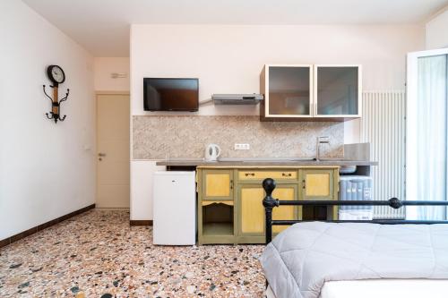 a small kitchen with a sink and a counter at Monti Guesthouse in Mestre