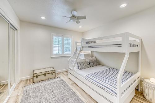 a bedroom with a bunk bed and a ceiling fan at Slide Creek Retreat in Bass Lake