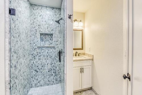 a bathroom with a shower and a sink at Slide Creek Retreat in Bass Lake