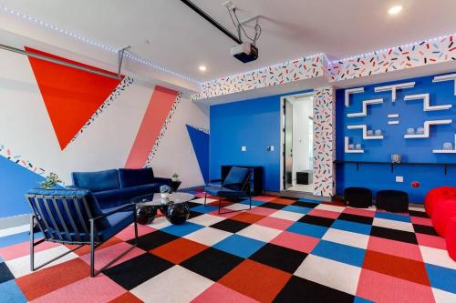a living room with a colorful floor and chairs at Posh Luxury Modern Home with Pool Spa and Rooftop Deck in Encino