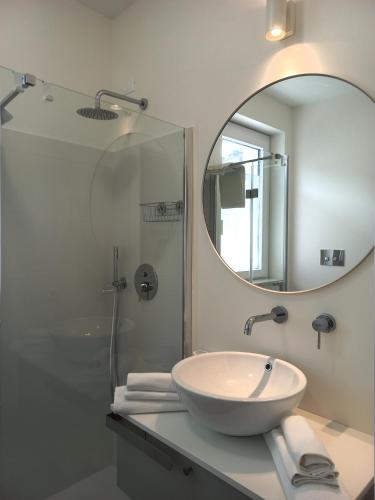a bathroom with a sink and a mirror at Dolce Dimora Charme Mare in Marina di San Vito