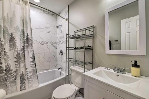 a bathroom with a sink and a toilet and a shower at Furnished Deck and Lake Access Poconos Place! in Tobyhanna