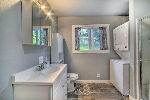 a white bathroom with a sink and a toilet at Cozy North Bend Getaway Near Dunes and Ocean! in Lakeside