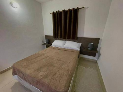a bedroom with a large bed in a room at Departamento entero in Asuncion