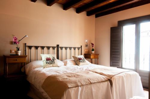 Posteľ alebo postele v izbe v ubytovaní Hotel Rural Princesa Kristina