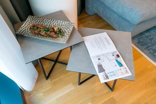 a table with two plates of food on top of it at Vienna Residence, Marina Tower - Danube in Vienna