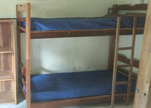 Uma ou mais camas em beliche num quarto em Sítio Porta das Águas