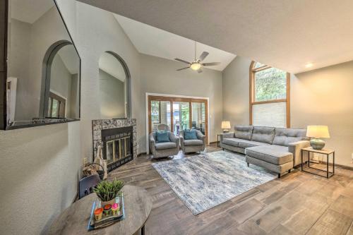a living room with a couch and a fireplace at Dreamy, Family-Friendly Cloudcroft Townhome! in Cloudcroft