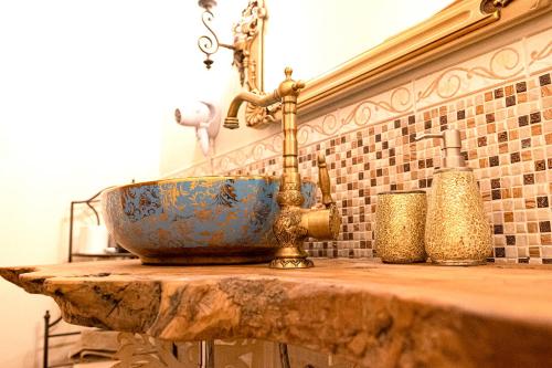 a bathroom with a sink on a stone counter at Casa alle Monache in Gambassi Terme