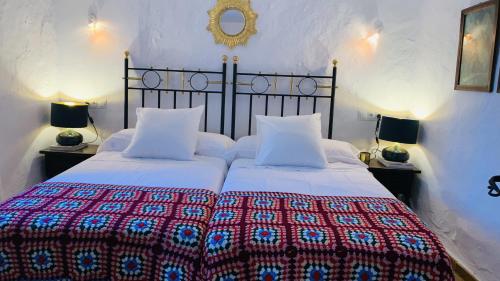 Postel nebo postele na pokoji v ubytování Casa Rural Faltriquera Setenil