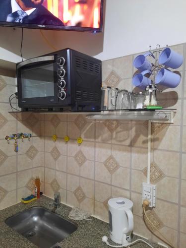 A kitchen or kitchenette at Complejo las Palmeras