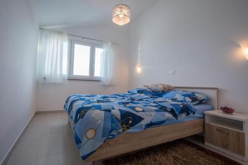 Apartment Verunic 14286d tesisinde bir odada yatak veya yataklar
