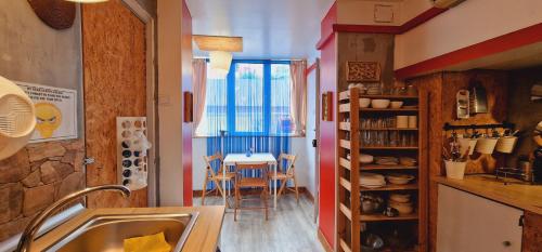 a kitchen with a table and a dining room at Mini Hostel in Lisbon in Lisbon