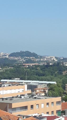 a view of a city with a train at Casa dragão in Porto