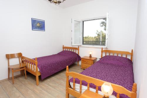 Posteľ alebo postele v izbe v ubytovaní Apartments by the sea Slatine, Ciovo - 16343