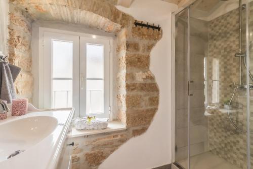 a bathroom with a sink and a glass shower at Family friendly house with a swimming pool Cerion, Central Istria - Sredisnja Istra - 16332 in Višnjan