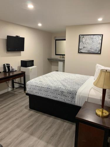 Ένα ή περισσότερα κρεβάτια σε δωμάτιο στο Westport Station Motel