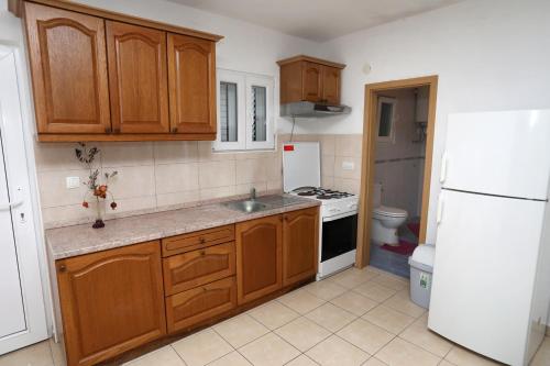 Kuchyň nebo kuchyňský kout v ubytování Apartment Vinisce 16439b