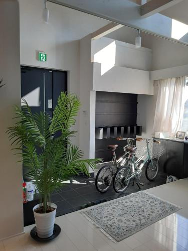 a kitchen with two bikes parked in a room at HANA TOYA in Lake Toya
