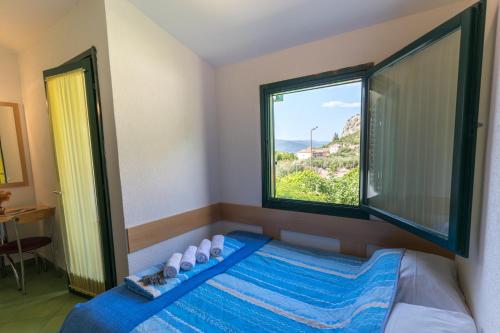 Ένα ή περισσότερα κρεβάτια σε δωμάτιο στο Apartment Klek 16545b