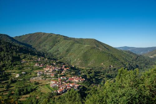 a small town in the middle of a mountain at Varanda de Sistelo in Sistelo