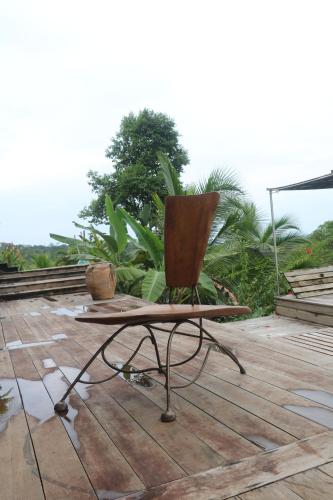 a chair sitting on top of a wooden deck at Villa F&B in Bocas del Toro