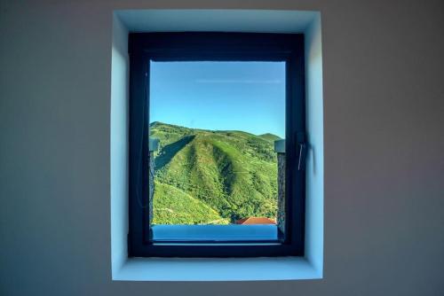 a window with a view of a mountain at Varanda de Sistelo in Sistelo