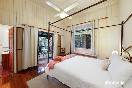 a bedroom with a bed and a large window at Addison's Montville in Montville