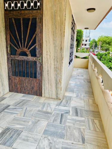 a door to a building with a tile floor at JAWAHAR VILLA - 2BHK - City Centre in Jodhpur