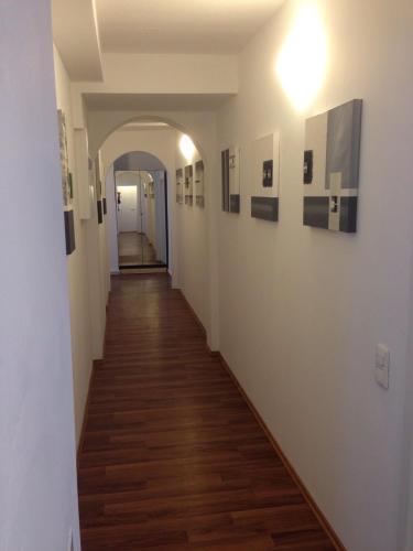 a hallway with paintings on the walls of a building at Porschepension in Wolfsburg