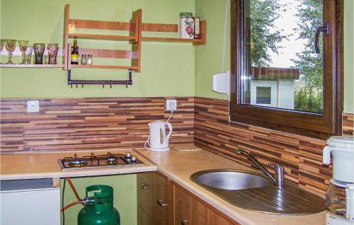 a kitchen with a sink and a counter top at 2 Bedroom Cozy Home In Leba-nowecin in Łeba