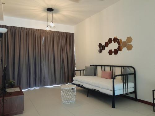 a bedroom with a bed in front of a window at The Landmark Comfort Relax Spacious Sea View By IZ in Tanjong Tokong