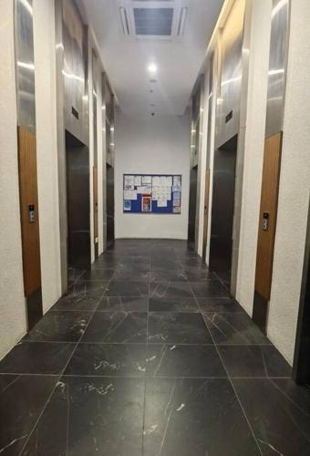 an empty hallway in a building with a painting on the wall at Almas Suite바다 전망 무지 100mbps 넷플릭스스텔라 국제학교까지 도보 2분 in Nusajaya
