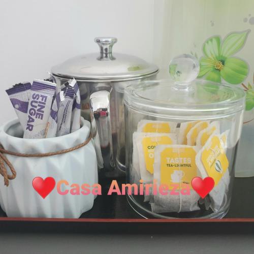 a tray with two containers of cheese and a sink at Casa Amirieza in Port Dickson