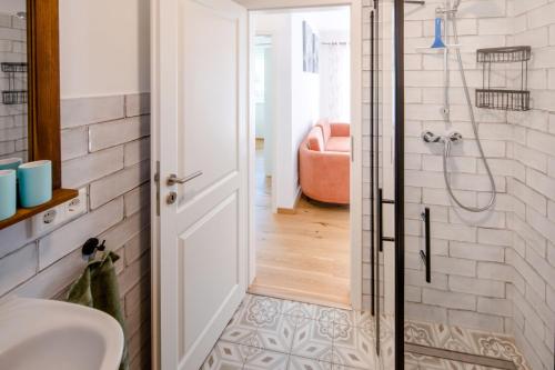 a bathroom with a shower and a sink at Chalet Altalmrich in Naumburg