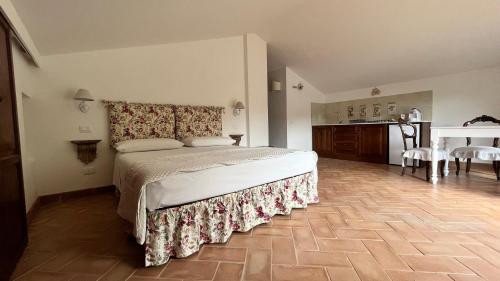 a bedroom with a bed and a table and chairs at Il Borgo Di San Michele in Papigno