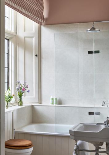 a white bathroom with a tub and a sink at Wildhive Callow Hall in Ashbourne