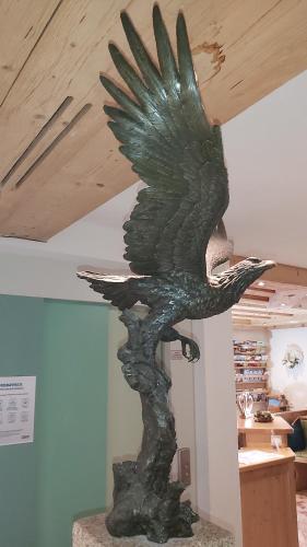 a statue of a bird sitting on top of a table at Adler Hotel-Pension in Fulpmes