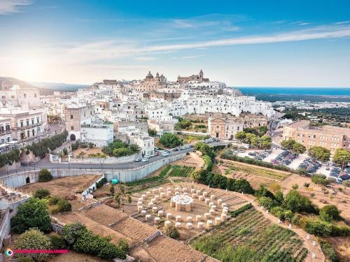 an aerial view of a city with white buildings at AROMA luxury in Ostuni