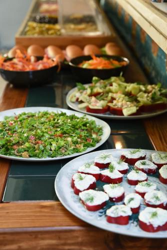 a table with three plates of food on it at The Marions Suite istanbul Special Category Taksim in Istanbul