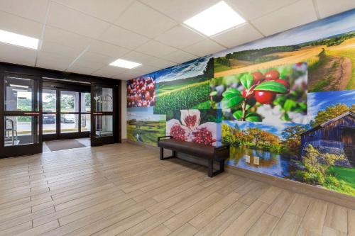 a large office room with a large mural on the wall at Clarion Pointe Tomah in Tomah