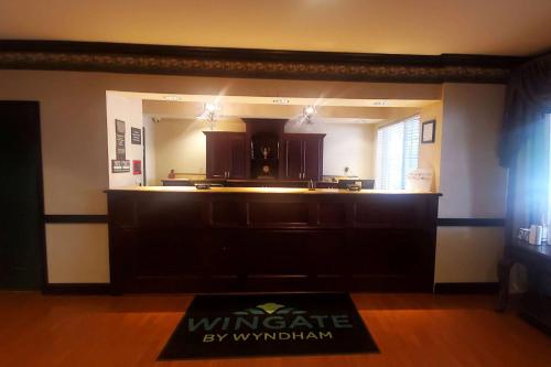 a kitchen with a large counter top in a room at Wingate by Wyndham Youngstown - Austintown in Youngstown