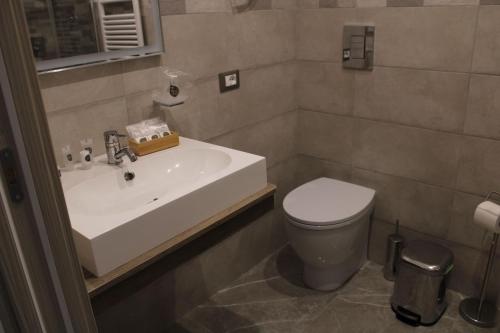 a bathroom with a sink and a toilet at B&B D'Amari Affittacamere in Palermo