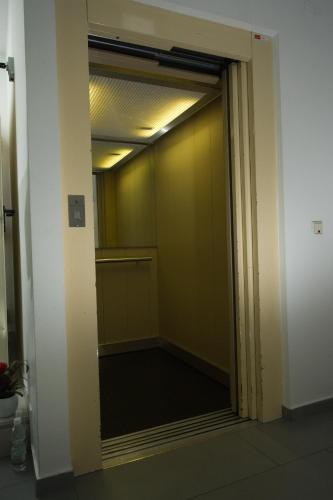 an elevator door in a building with a hallway at Hotel City Residence in Vienna