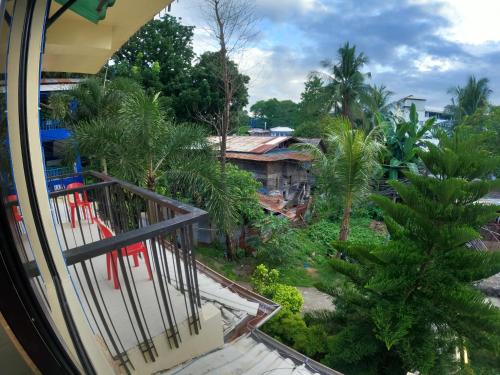 a view of a village from a balcony at Antwet Backpacker's Inn & Rooftop Bar in Dumaguete