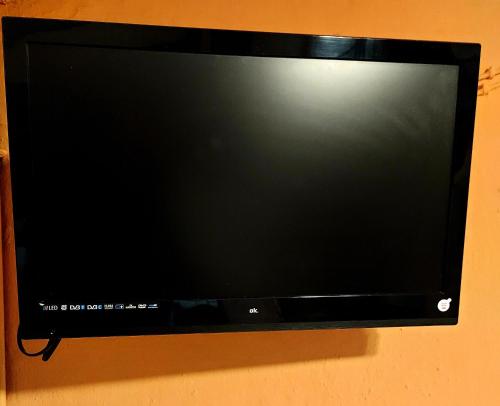 a flat screen tv hanging on a wall at Casa del Águila del Valle in Riópar Viejo