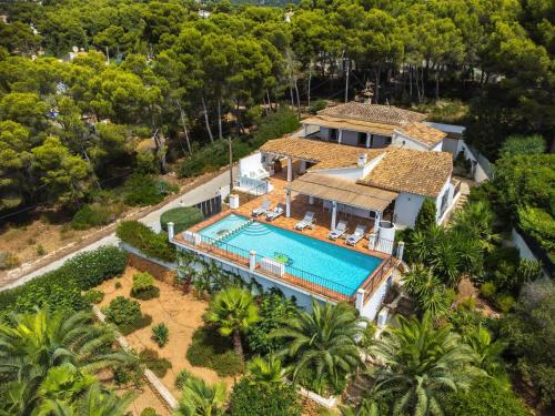 an aerial view of a house with a swimming pool at ROMERO - Managed by Almarina Villas in Benissa